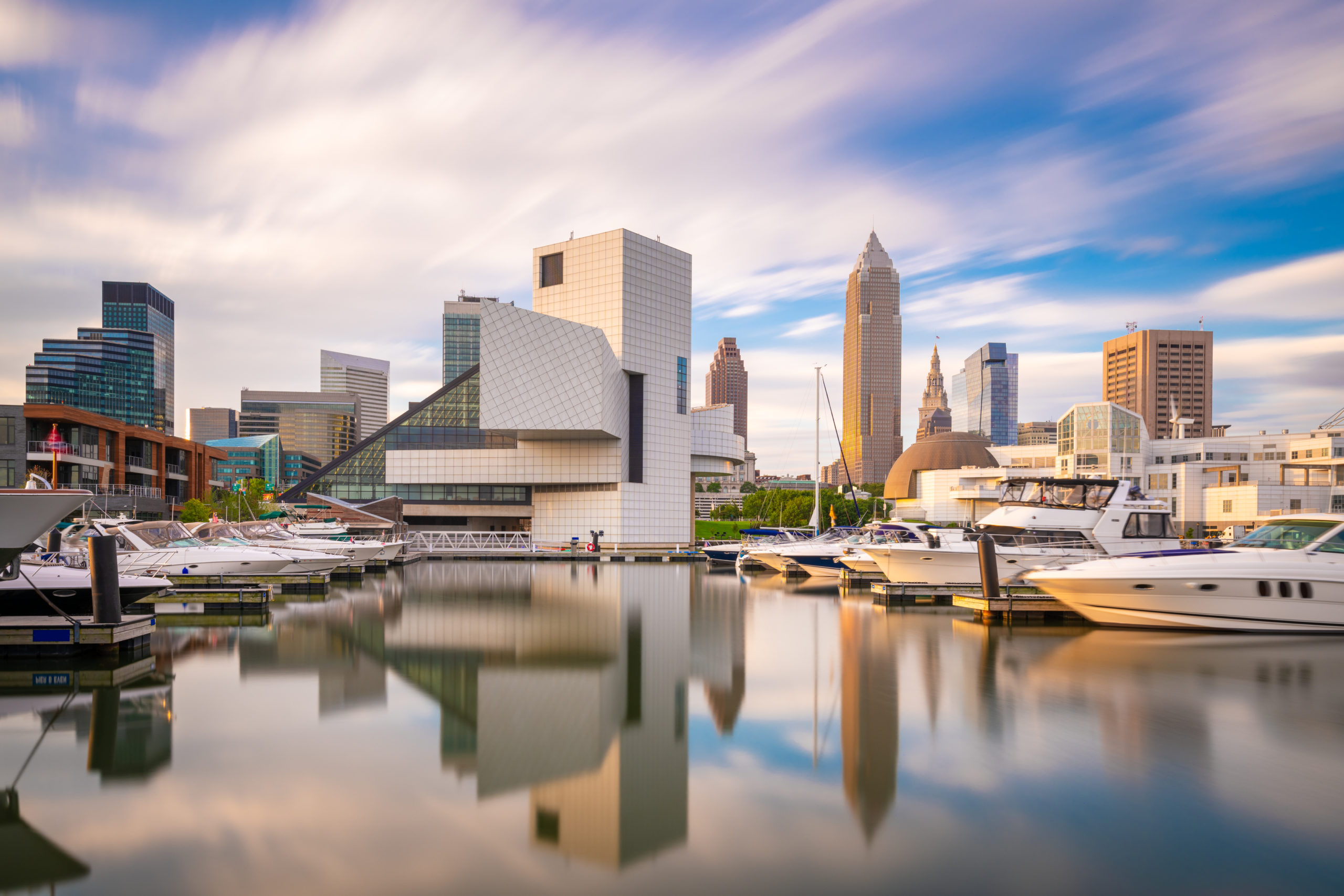 downtown view of cleveland, ohio from lake erie with focus on the rock and roll hall of fame and the keybank tower