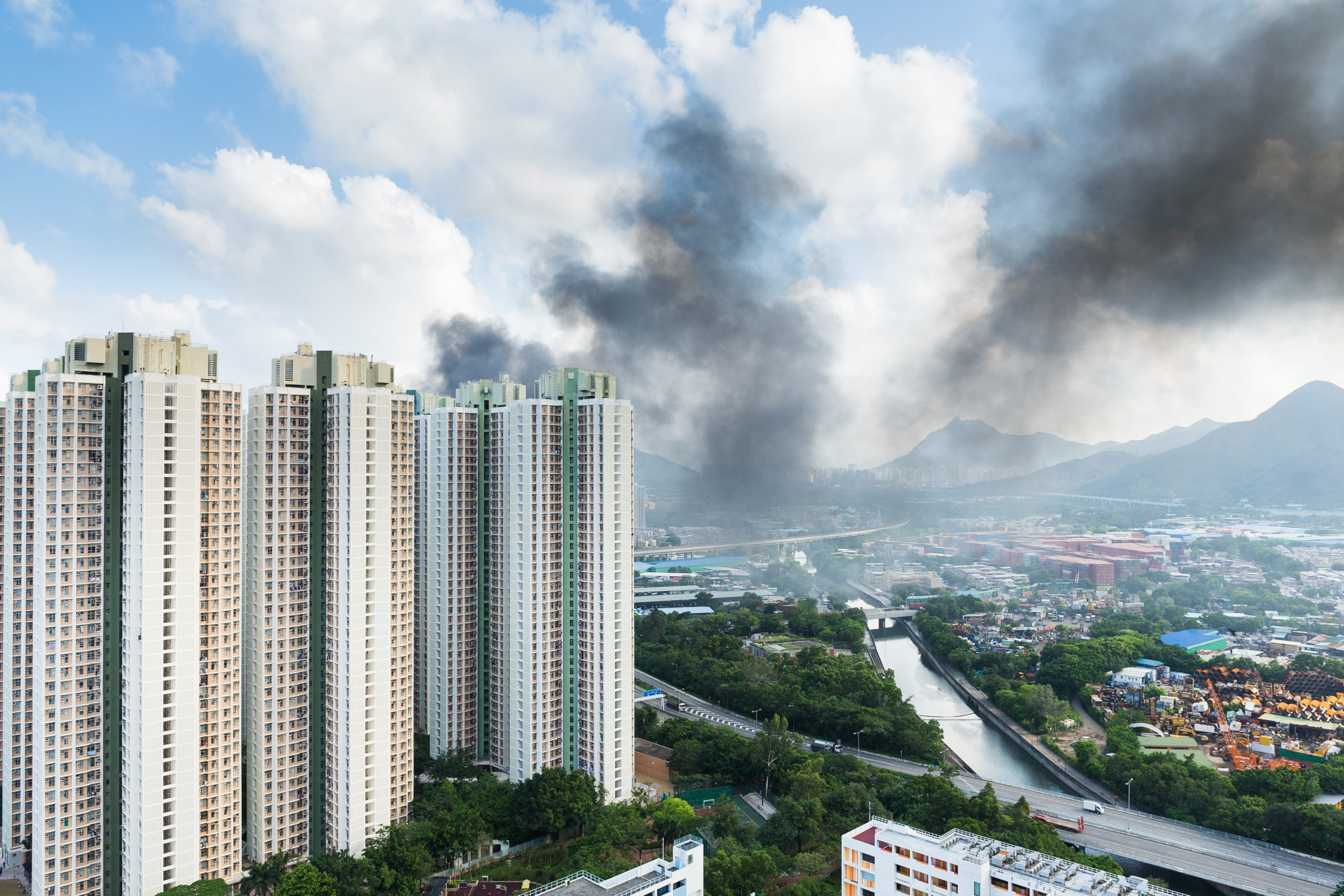 image of a high rise building and/or or condominium on fire and resulting smoke